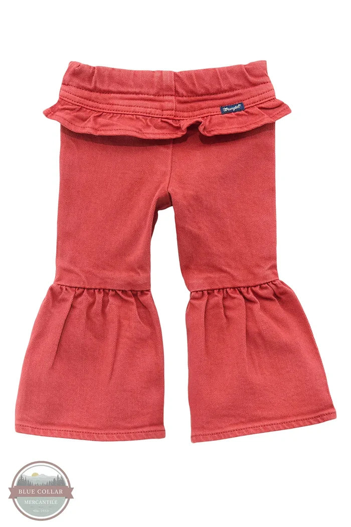Red ruffled pants on a white background There’s no denying how cute your cowgirl will look in our Little Girl’s Vibrant Ruffle Leg Flare Jean. These flares are crafted from a soft cotton blend with a hint of stretch for extra comfort. They feature an elastic waist for easy changing, ruffles along the back for extra flair, and ruffled legs that will have her ready for the rodeo.
Fit: Regular
Waist: Elastic
Leg: Flare back