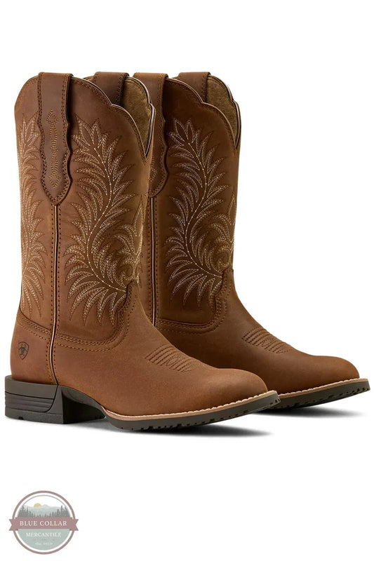 Pair of brown cowboy boots with intricate designs on a white background Ariat 10063901 Hybrid Ranchward W Toe Western Boot
