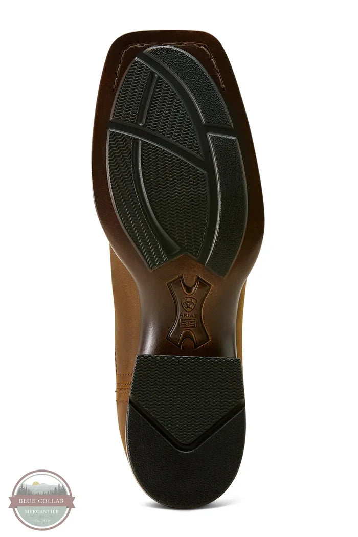 Close-up of a brown shoe sole with black tread pattern on a white  Ariat 10063973 Booker Chelsea Wide Square Toe Western Bootbackground