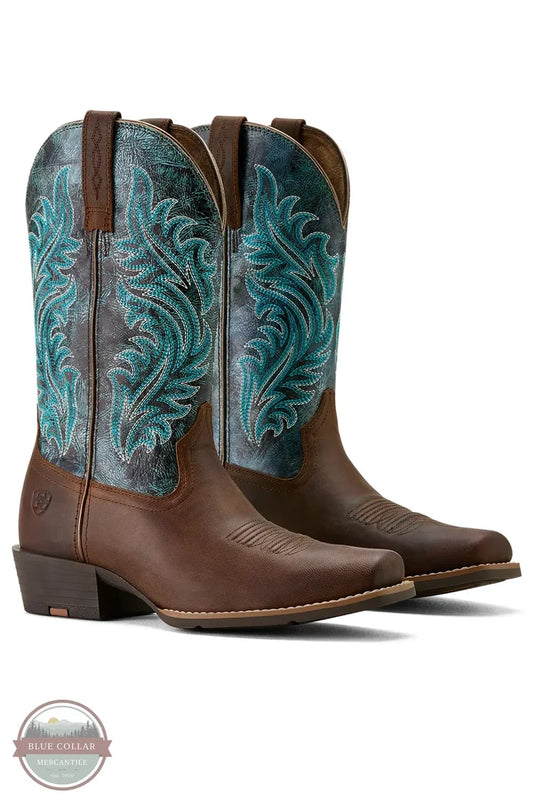 Brown cowboy boots with turquoise embroidery on a white background Ariat 10064077 Round Up Narrow Cutter Toe Western Boot