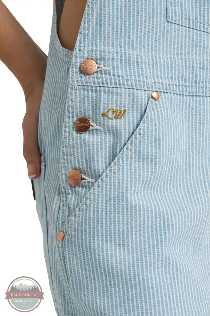 Wrangler 112375656 Lainey Wilson Stripped Cargo Bib Overalls front pocket initials detail view