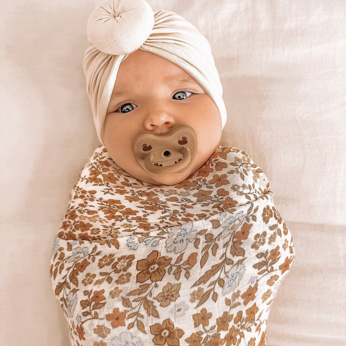 MWRAP25-BroderieSwaddle-LikedByLeo-5-square.jpg