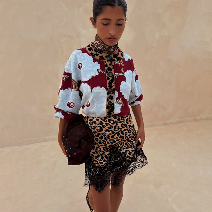 Burgundy & Blue Poppy Cardigan with leopard print trim and poppy motifs, paired with a lace-trimmed leopard skirt.