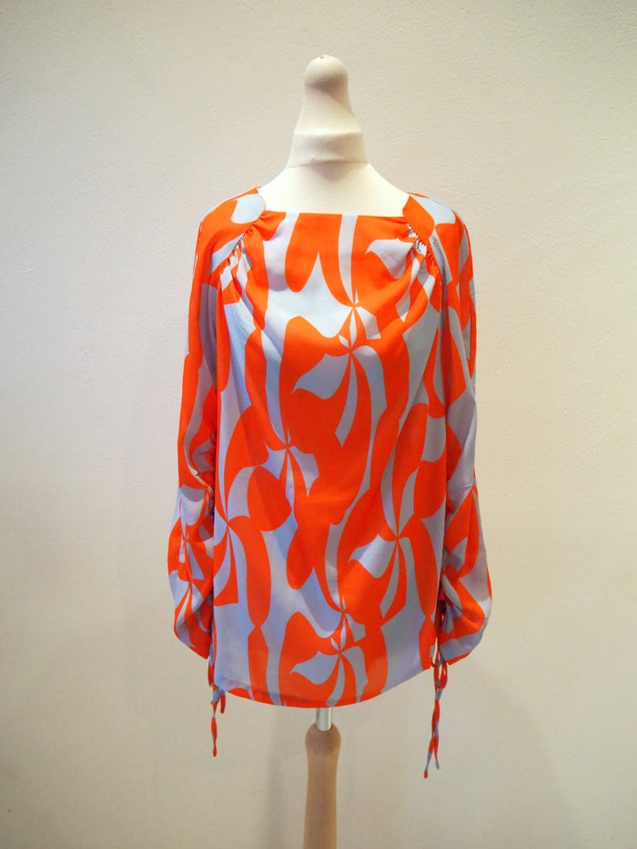 Lennon Courtney at Dunnes Orange/Blue blouse 10