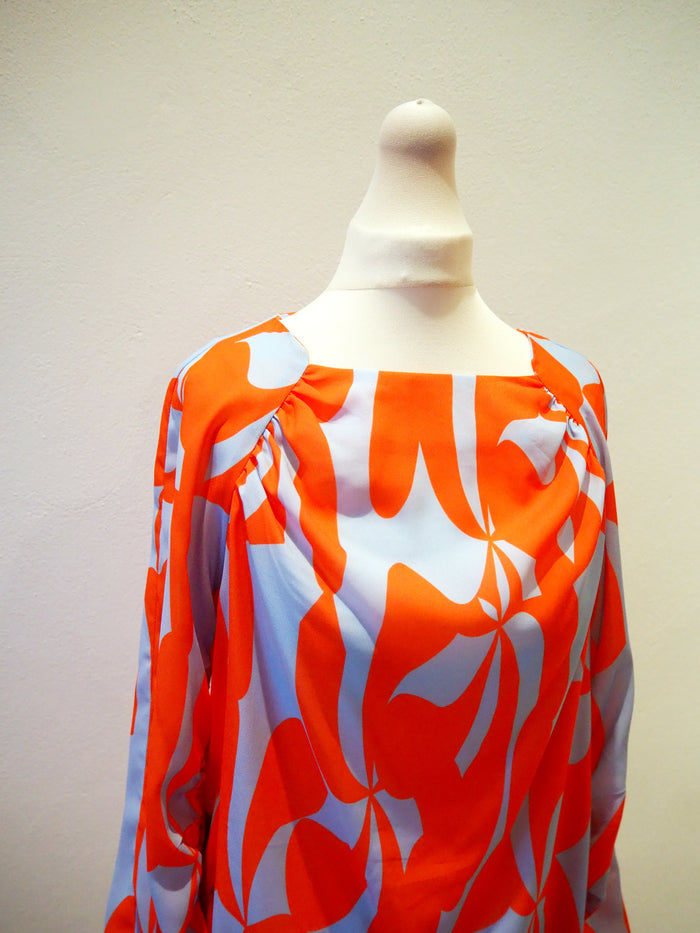 Lennon Courtney at Dunnes Orange/Blue blouse 10
