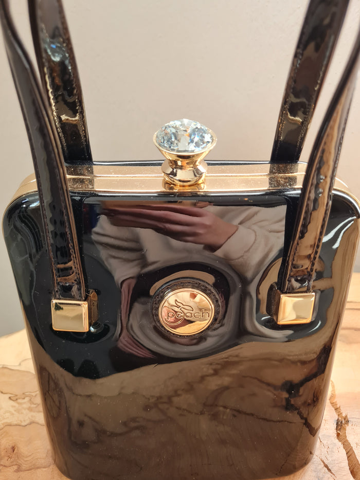 Peach black patent handbag