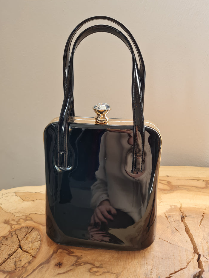 Peach black patent handbag