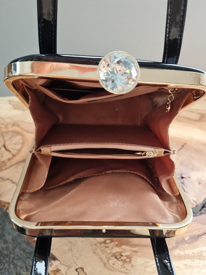 Peach black patent handbag